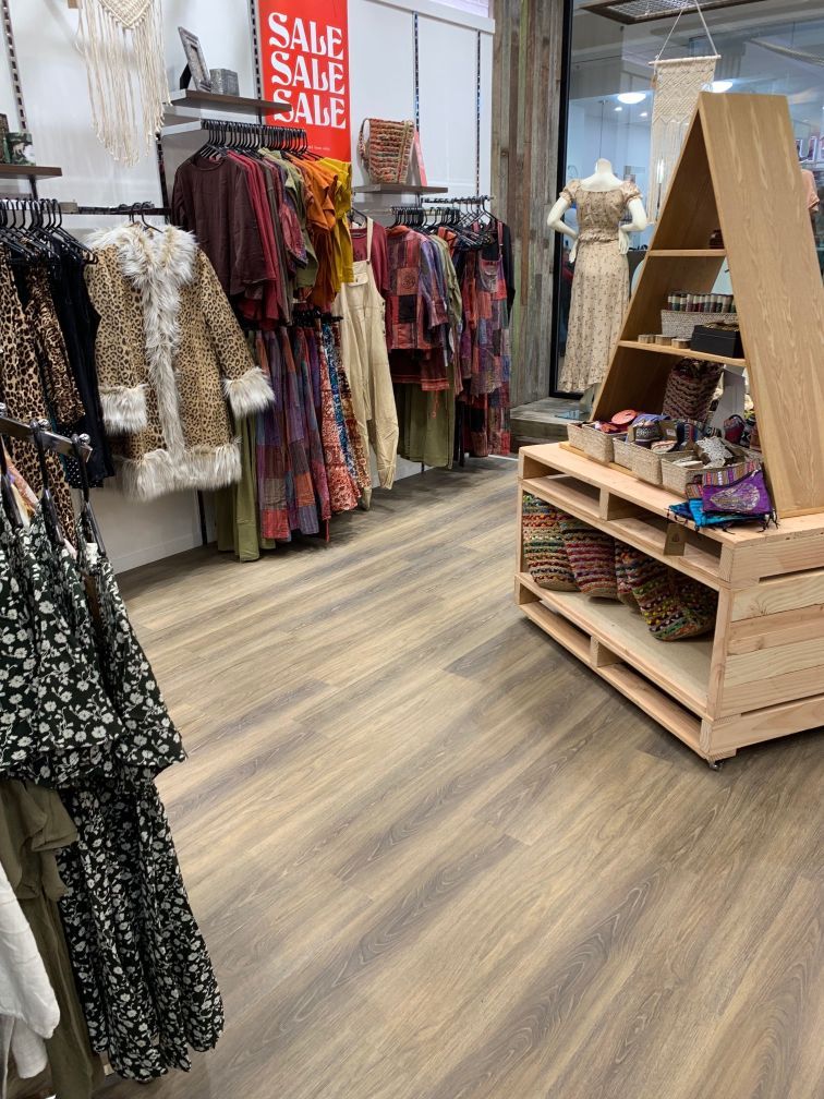 Clothes Displayed In Shop With Vinyl Flooring — Geoff Thompson's Independent Flooring Centre In Port Macquarie, NSW