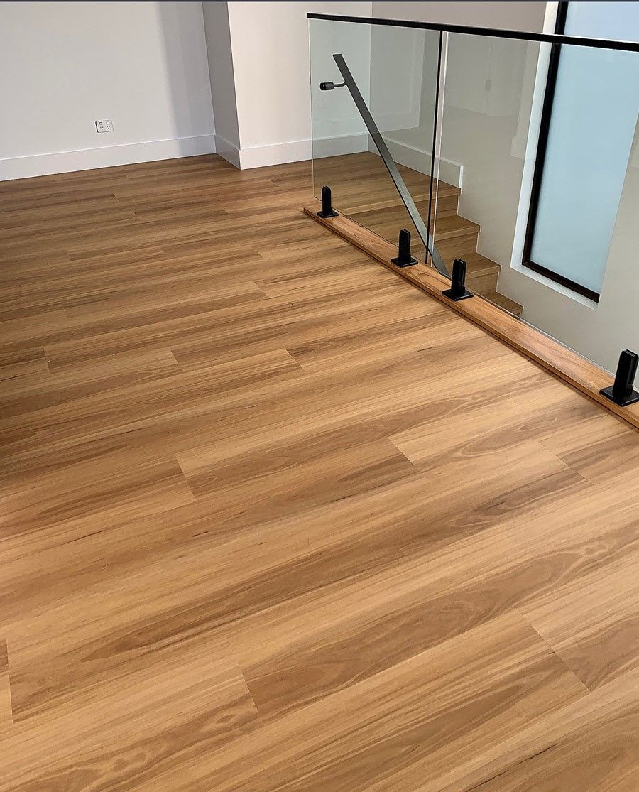 A Room with A Wooden Floor and A Glass Railing — Geoff Thompson's Independent Flooring Centre In Port Macquarie, NSW