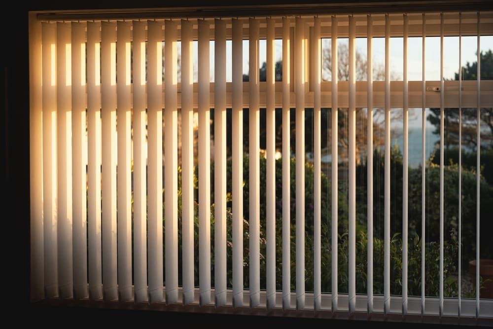 The Sun Is Shining Through The Vertical Blinds — Geoff Thompson's Independent Flooring Centre In Port Macquarie, NSW