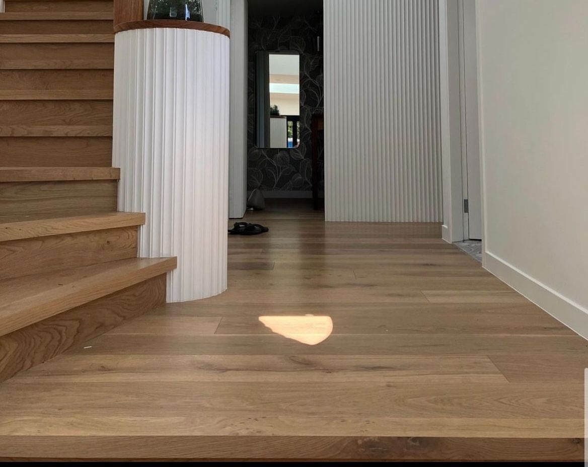 Worker Installing Wood Floor For Patio — Geoff Thompson's Independent Flooring Centre In Port Macquarie, NSW