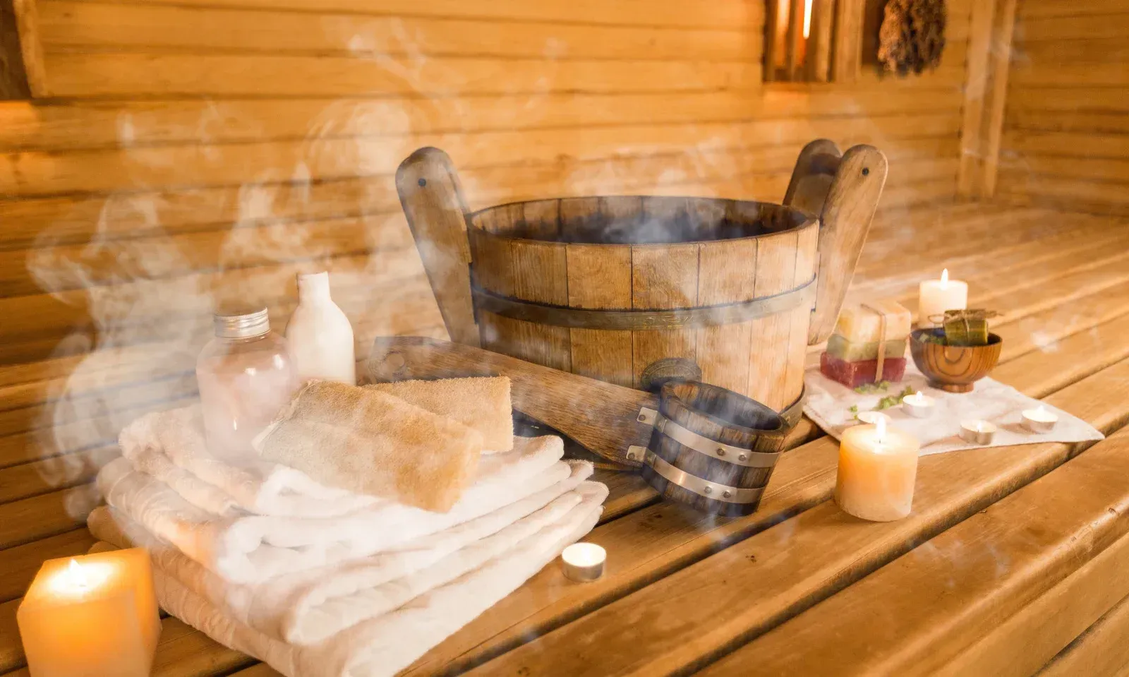A table topped with bottles of essential oils and herbs.