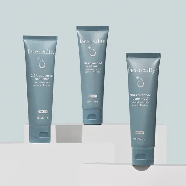 Three bottles of face reality are sitting on a shelf