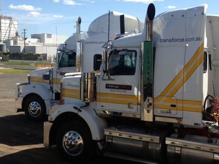 Two Semi Trucks Are Parked Next to Each Other in a Parking Lot — Transforce in Parkes, NSW