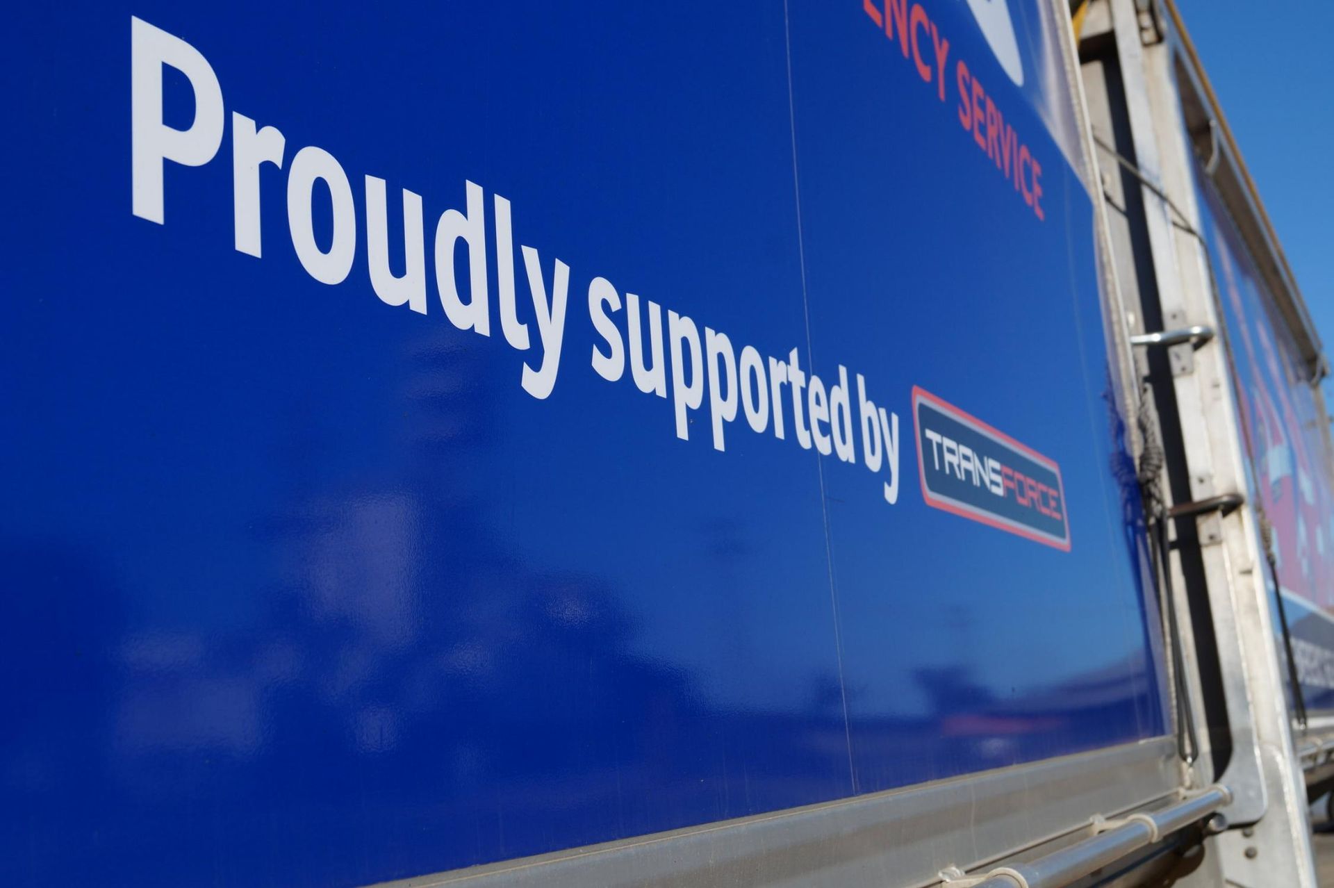 The Side of a Blue Truck Says Proudly Supported by Transport — Transforce in Bathurst, NSW