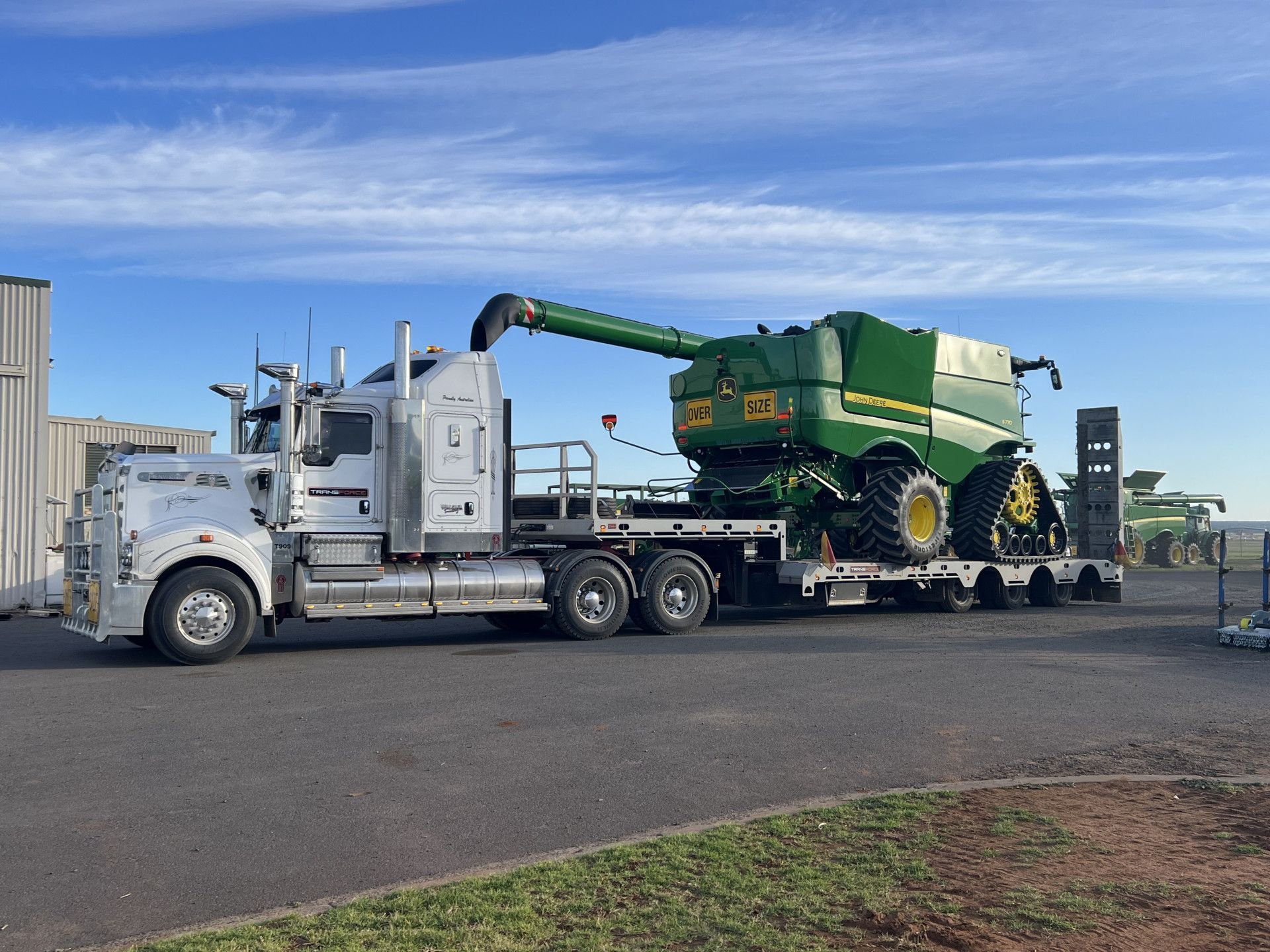 Semi Truck is Towing a Trailer in a Dirt Field — Transforce in Dubbo, NSW