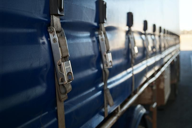 Blue Truck With a Tarp on It is Parked on the Side of the Road — Transforce in Bathurst, NSW