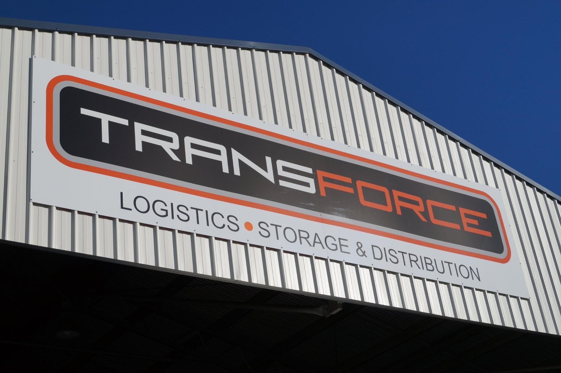 Sign on a Building That Says Transforce Logistics Storage and Distribution — Transforce in Orange, NSW
