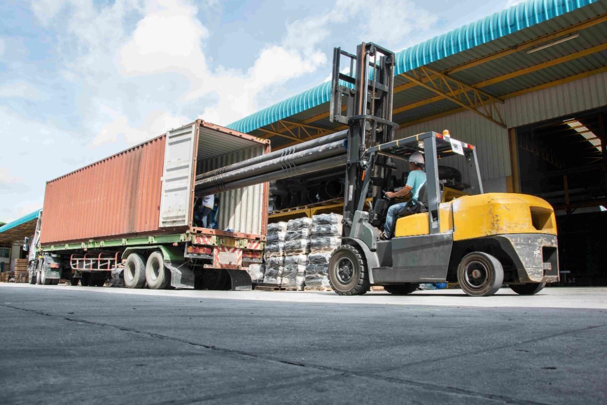 Forklift is Loading a Container Onto a Truck in a Warehouse — Transforce in Narromine, NSW