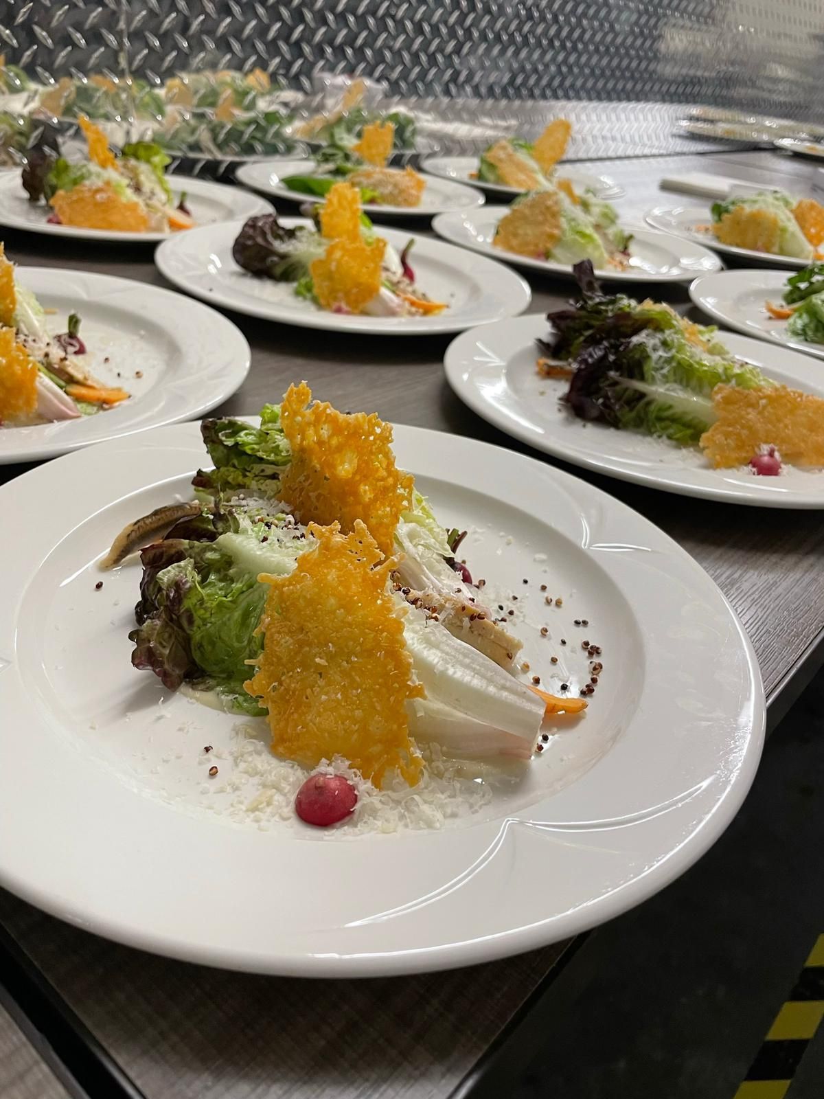 A bunch of plates of food are sitting on a table.