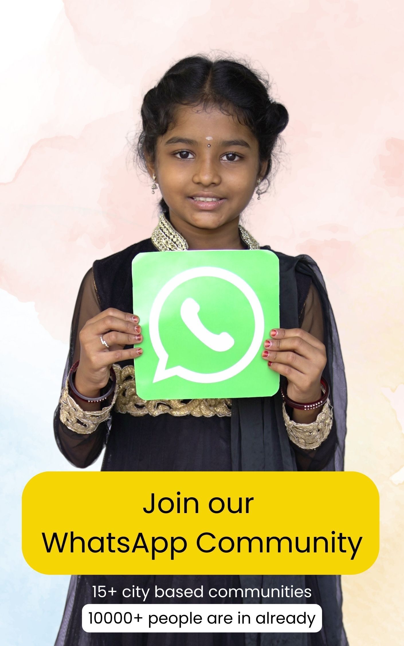 A little girl is holding a sign that says `` join our whatsapp community ''.