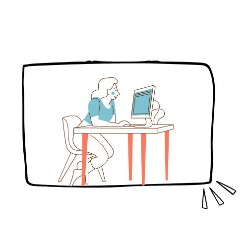 A woman is sitting at a desk using a computer.
