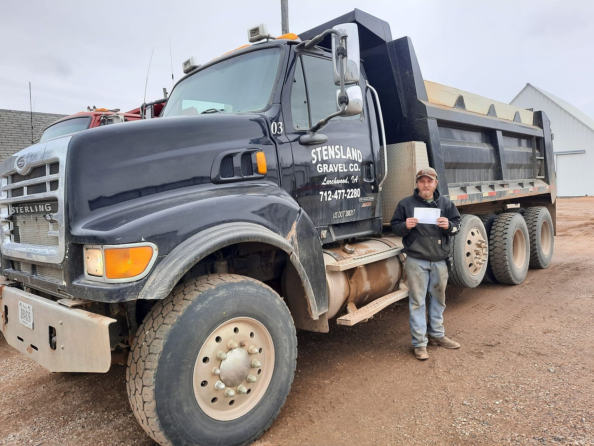 Stensland Gravel dump truck ready for gravel delivery services in Larchwood, Iowa