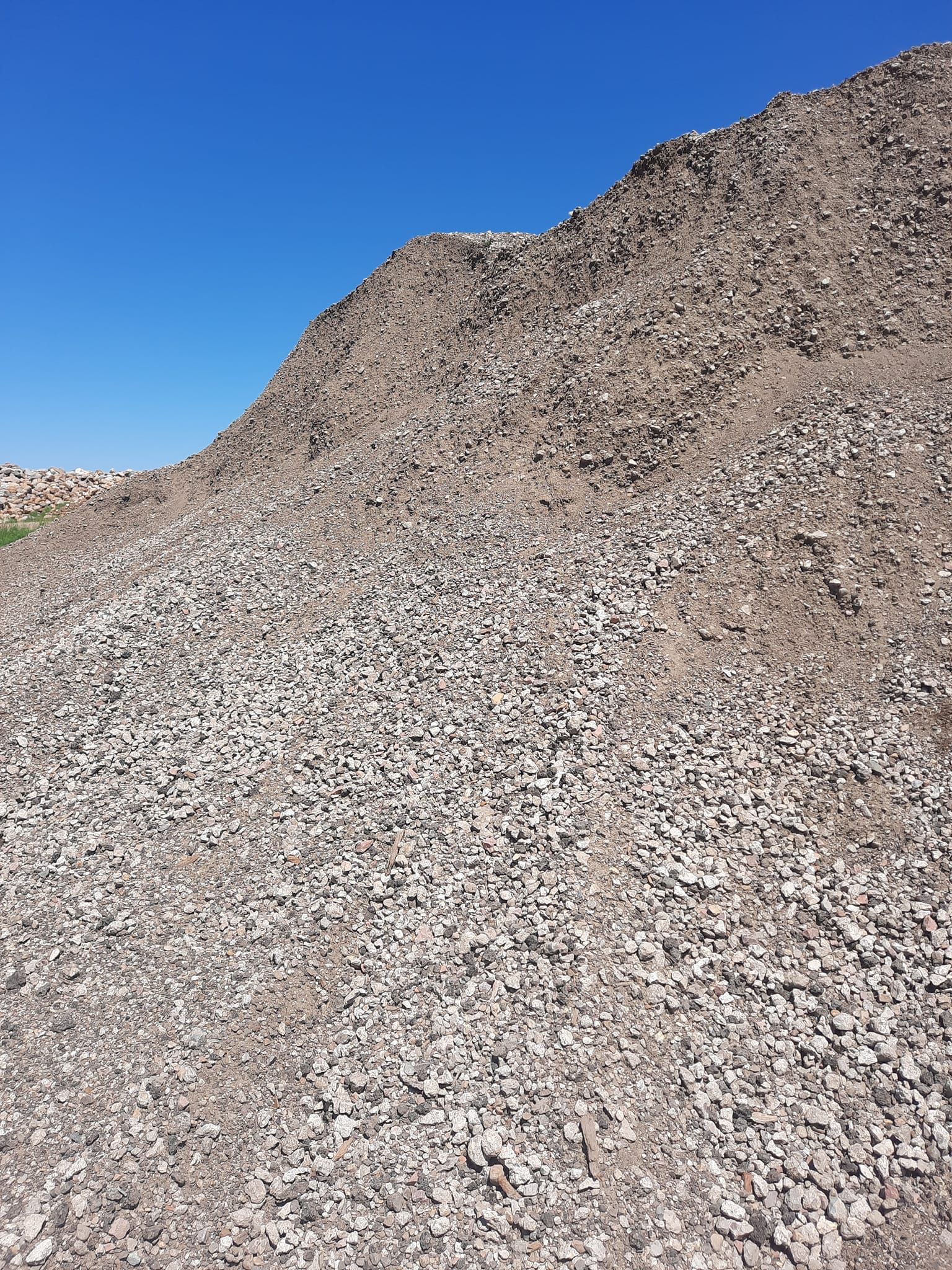 Screened gravel aggregate stockpile for construction and landscaping projects in Larchwood, Iowa