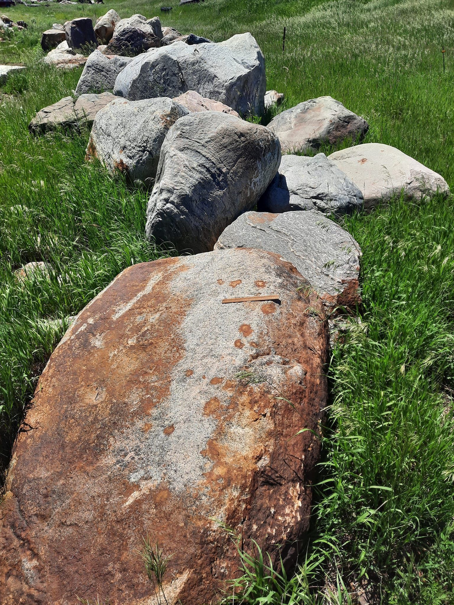 Large natural granite boulders available for landscaping projects from Stensland Gravel in Larchwood, Iowa