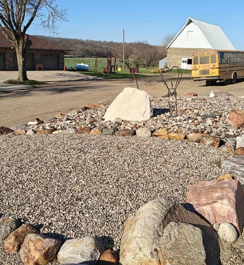 Decorative river rock and landscape stone display installed by Stensland Gravel in Larchwood, Iowa