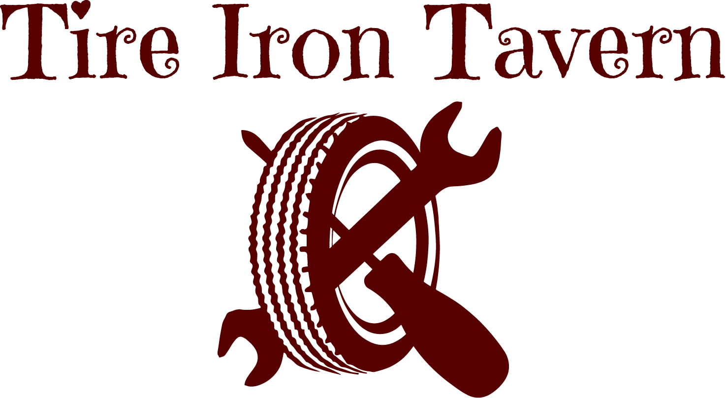 A tire iron tavern logo with a tire and a wrench