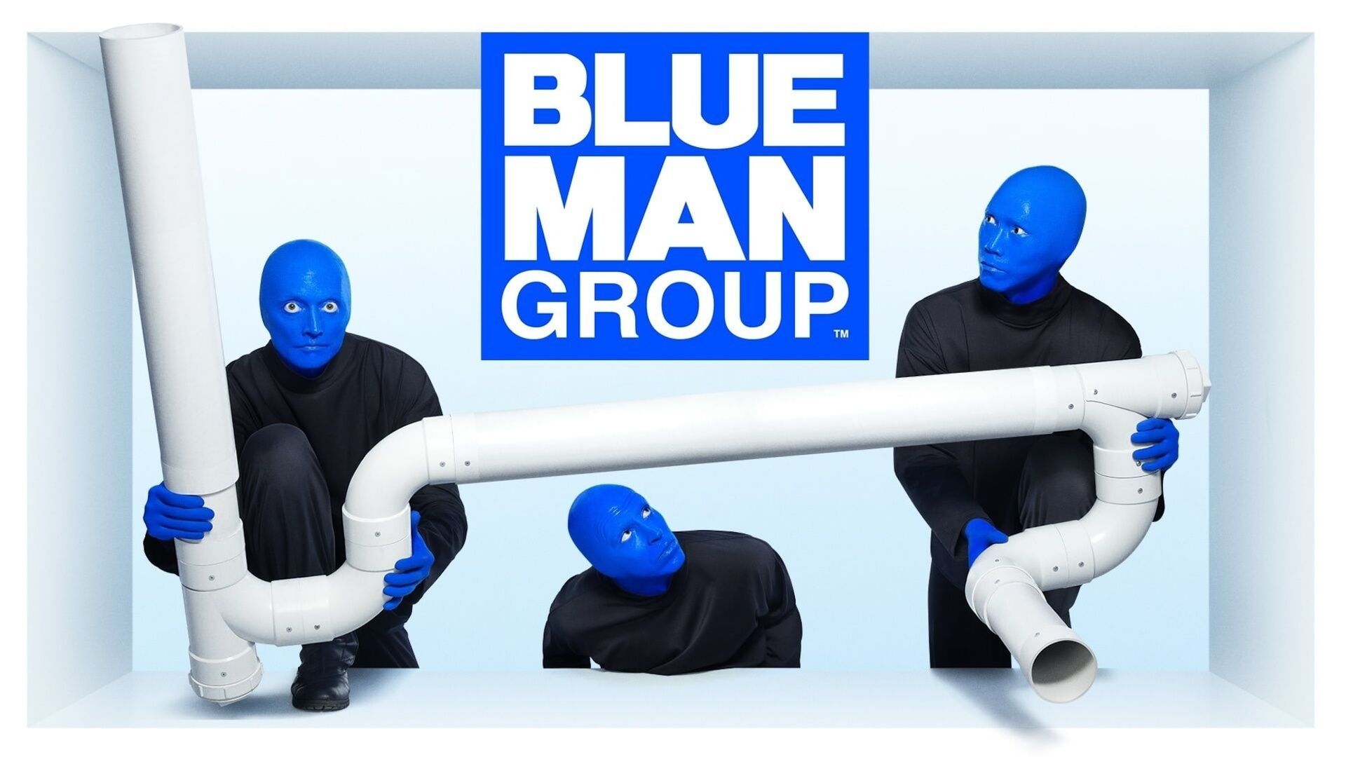 a blue man group logo with three blue men holding pipes