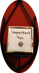 A picture frame with imperfect ten written on it