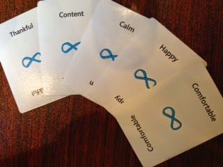 A bunch of white cards with blue infinity symbols on them