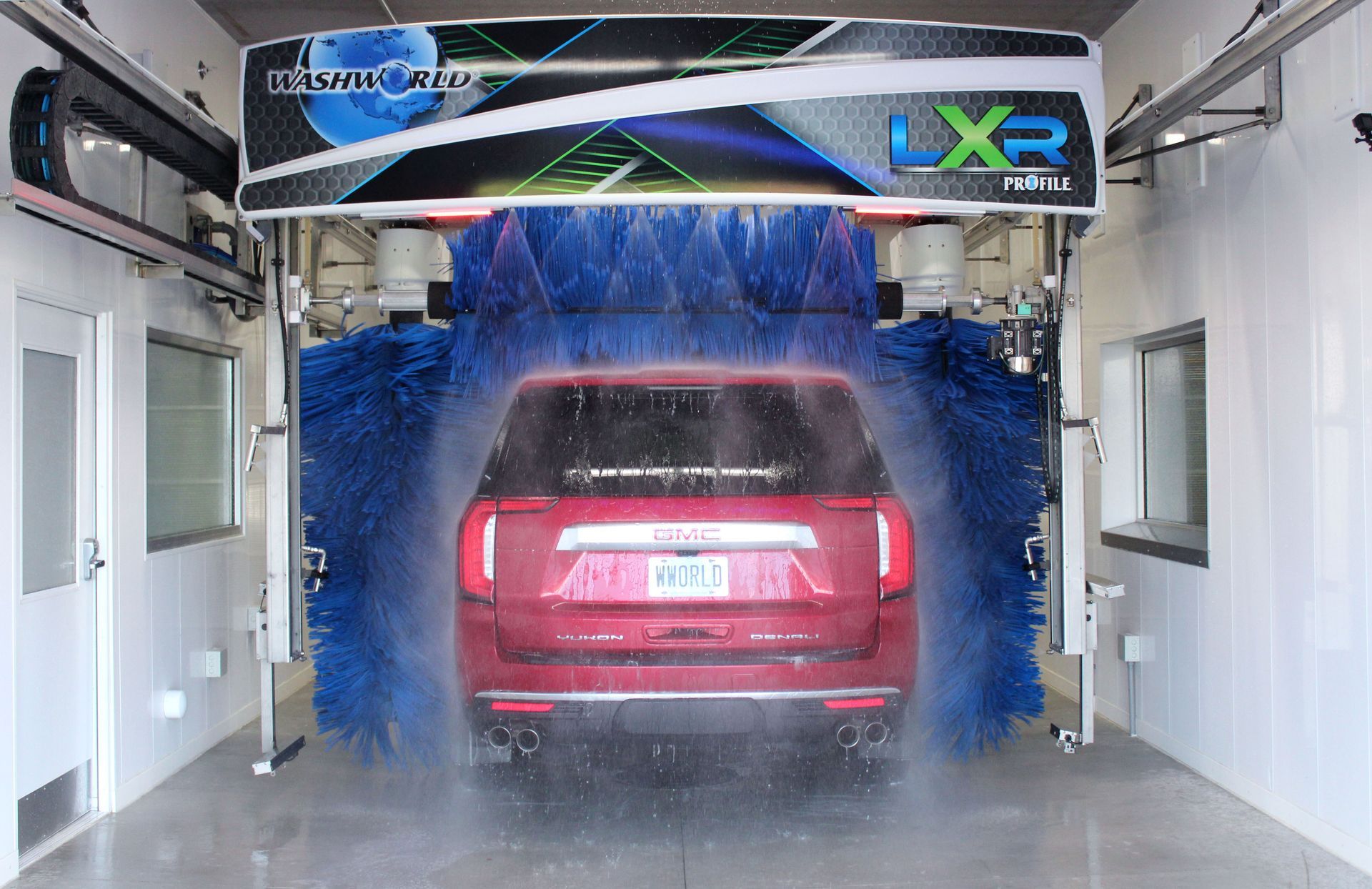 Red SUV in a Apex car wash bay