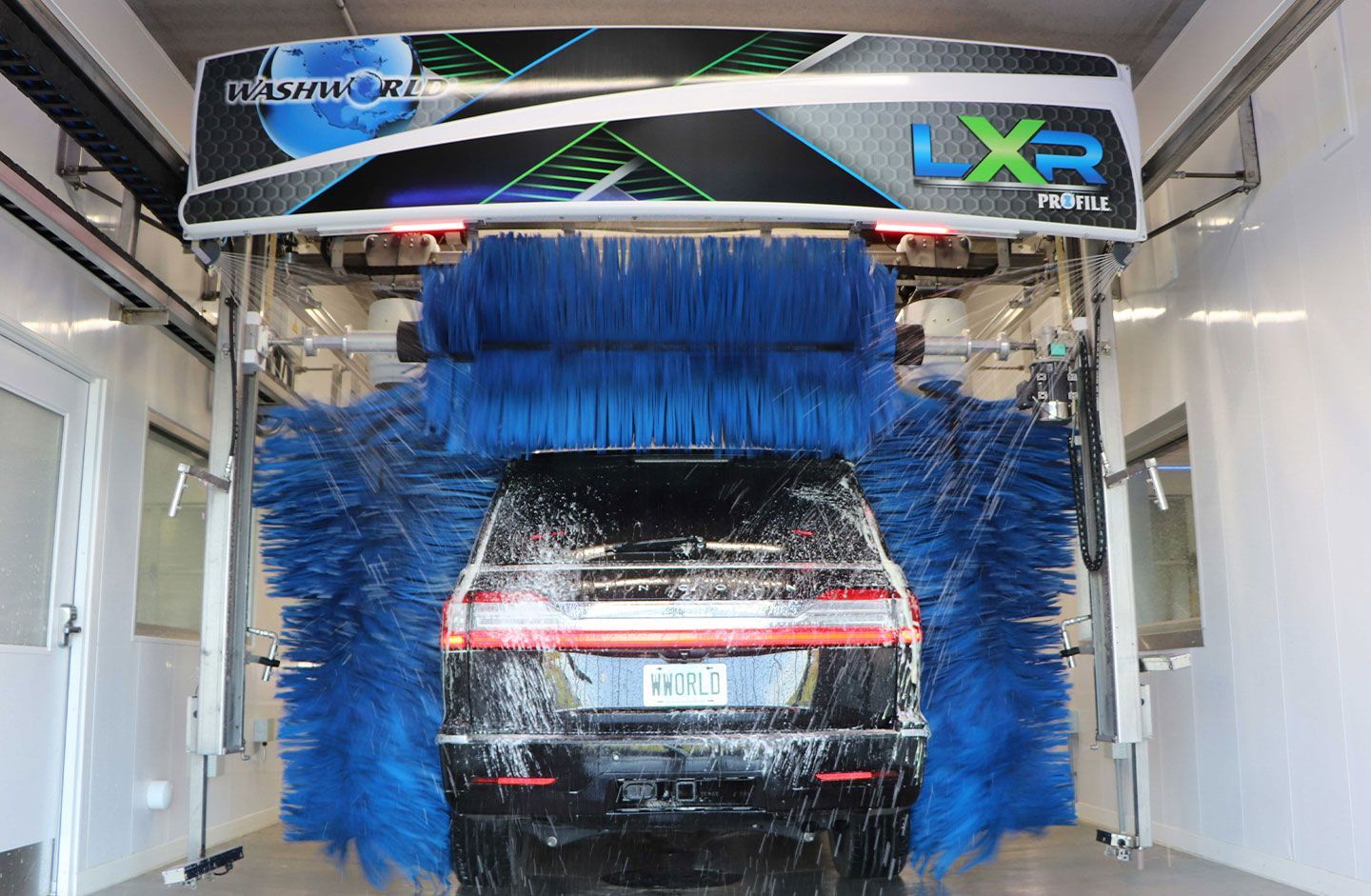 Black car being washed at an automatic car wash LXR. 