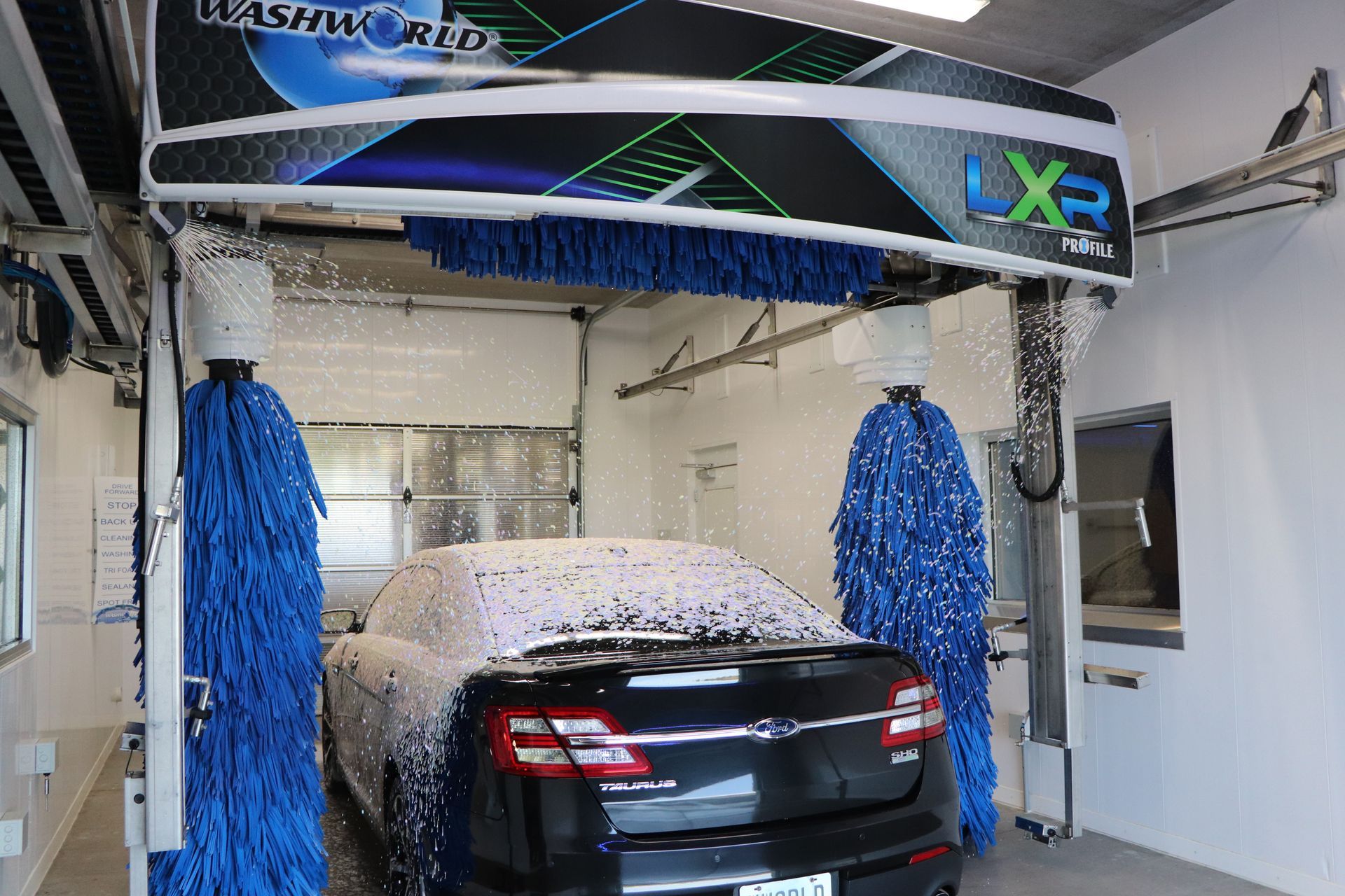 A black car being washed by a Profile LXR.