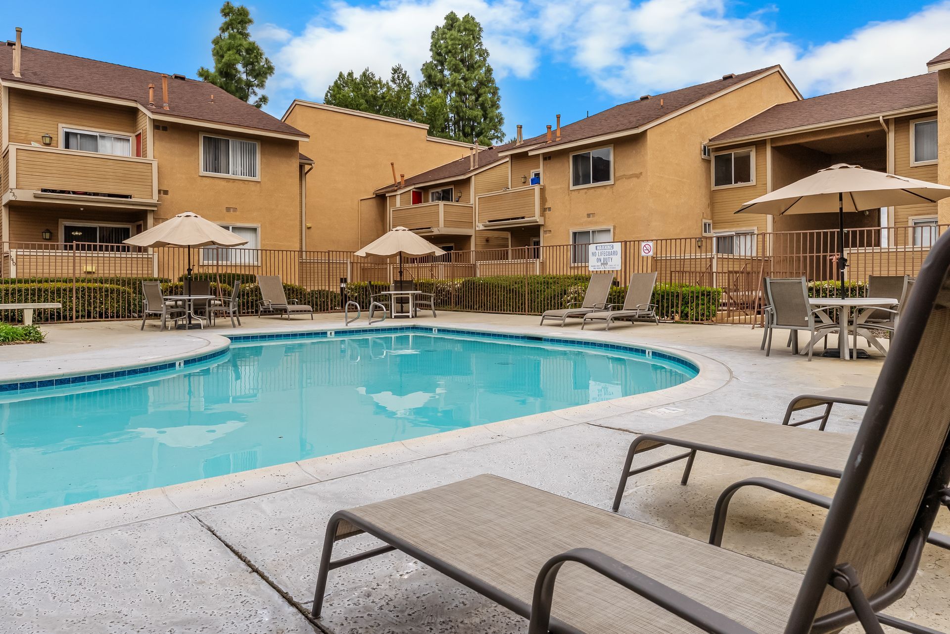 swimming pool with lounge chairs