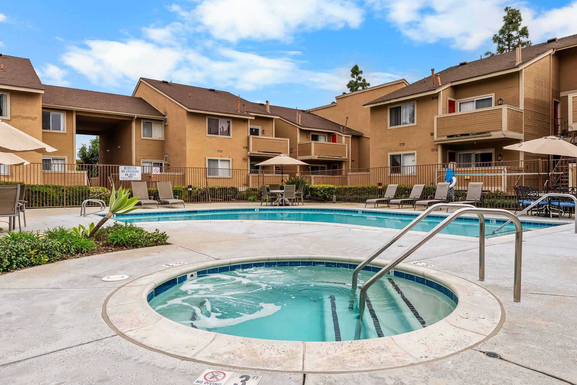 jacuzzi spa, pool, and apartment exterior