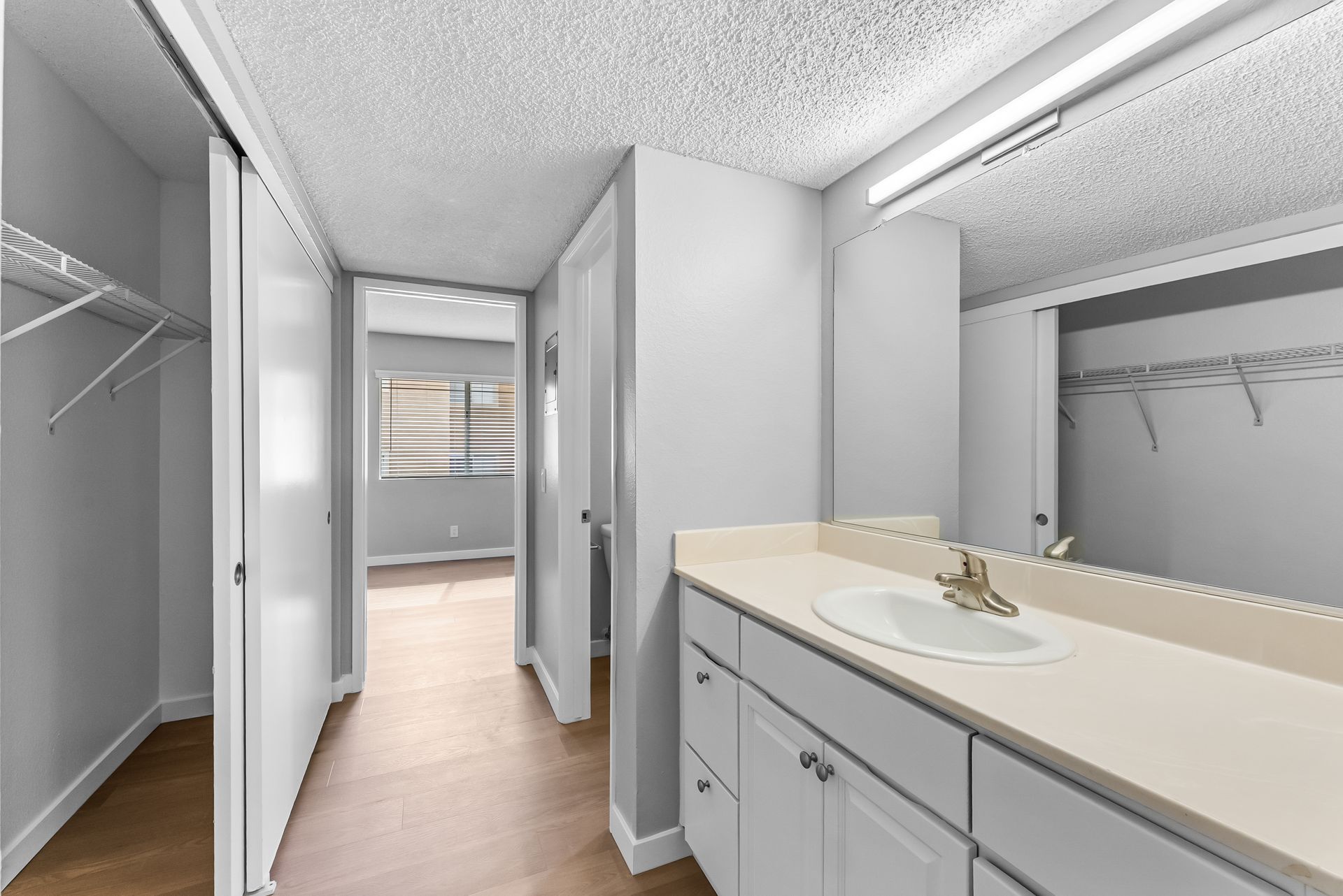 wallway with sink and cupboards