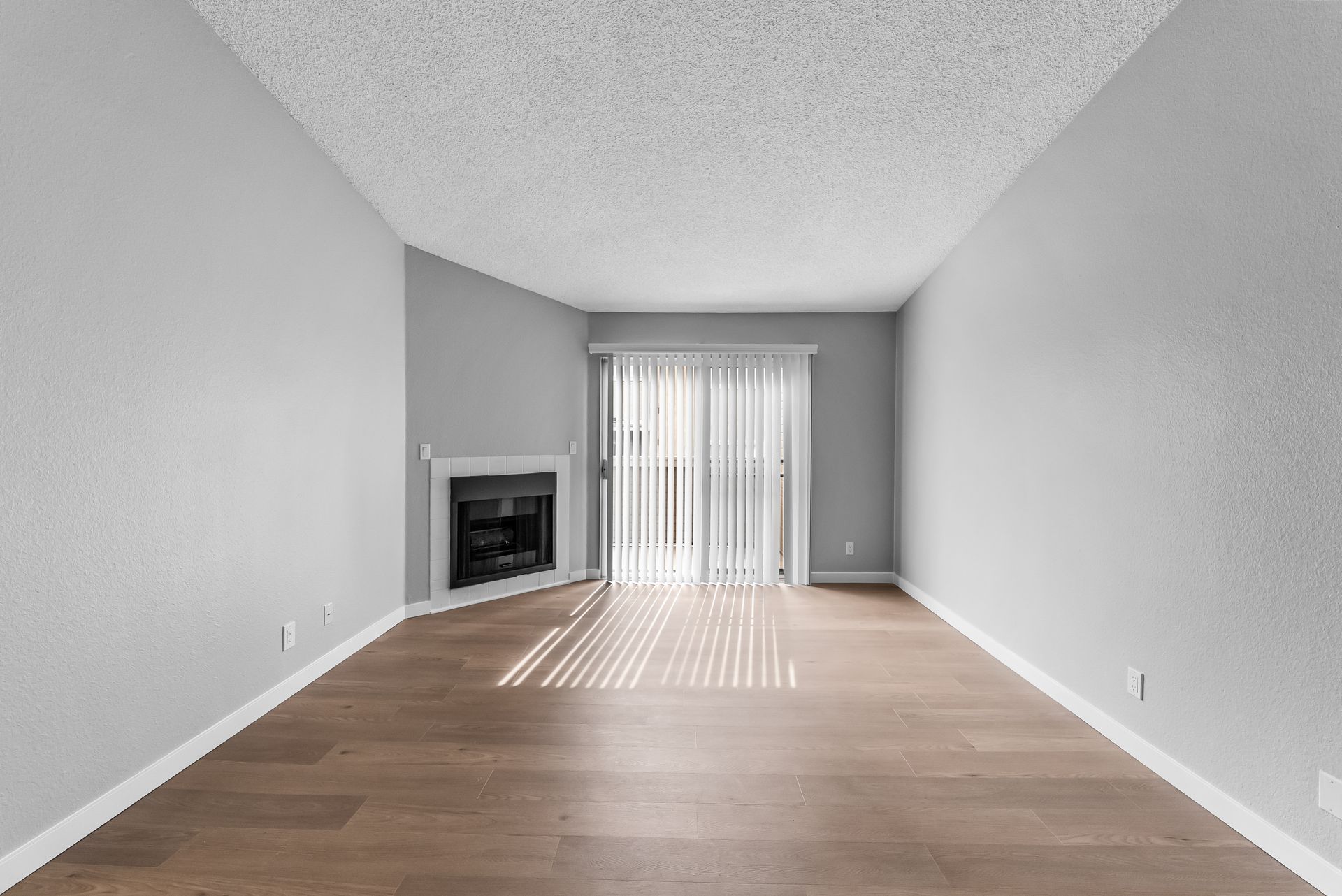 living room with fireplace and door to patio