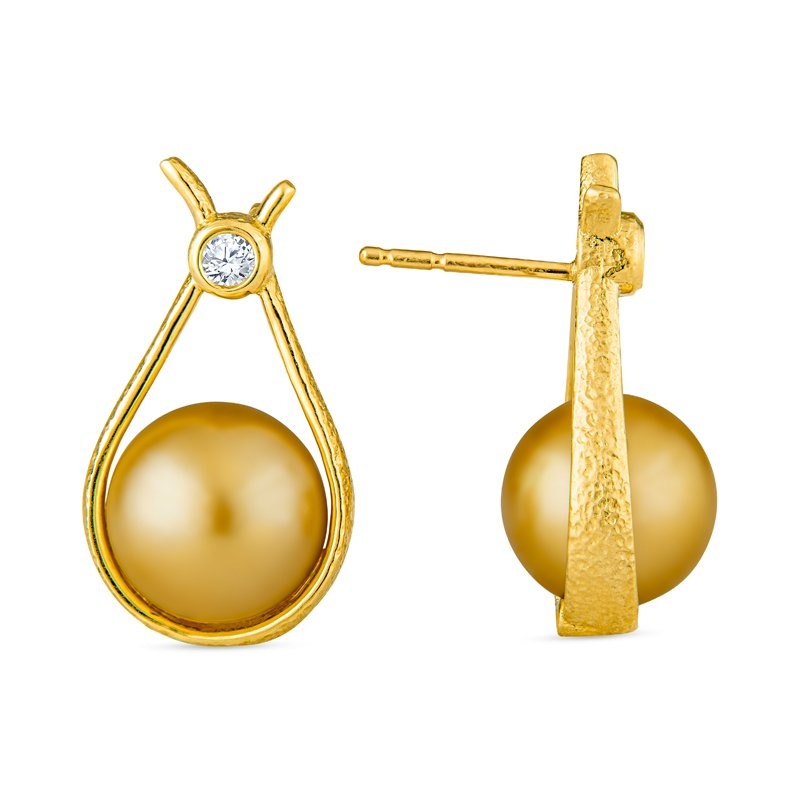 A pair of gold earrings with a pearl and a diamond
