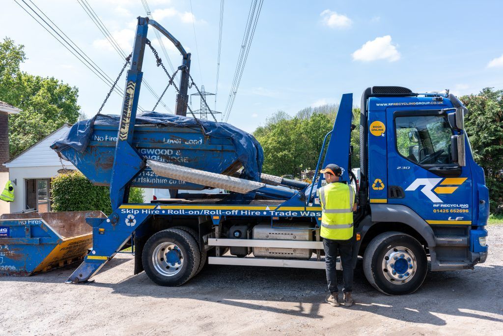 rf recycling lorry loading a skip