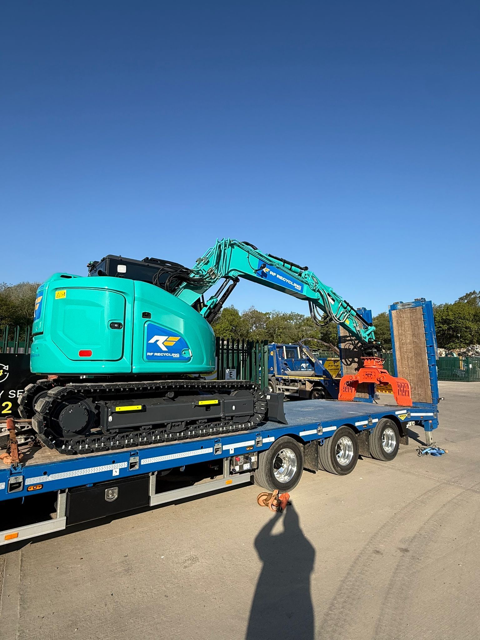 new kobelco digger arrives on a lorry at RF Recycling Group in Fordingbridge