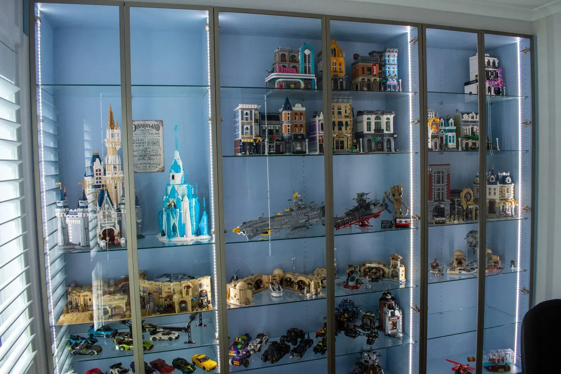 A display case filled with lots of lego toys.