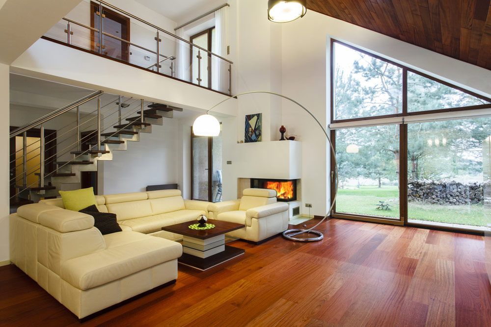 A Living Room With White Furniture And A Fireplace — Professional Painters in Suffolk Park, NSW