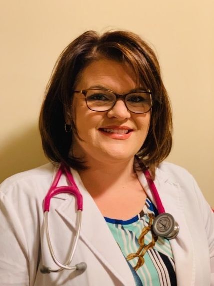 A woman wearing glasses and a stethoscope around her neck
