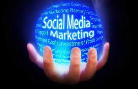 A person is holding a sphere with the words social media marketing written on it.