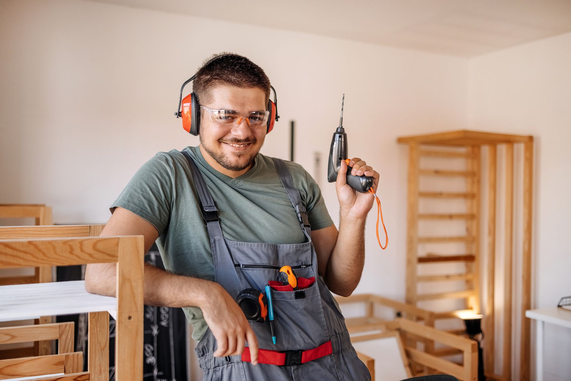 man making things out of wood in his small home carpentry workshop.