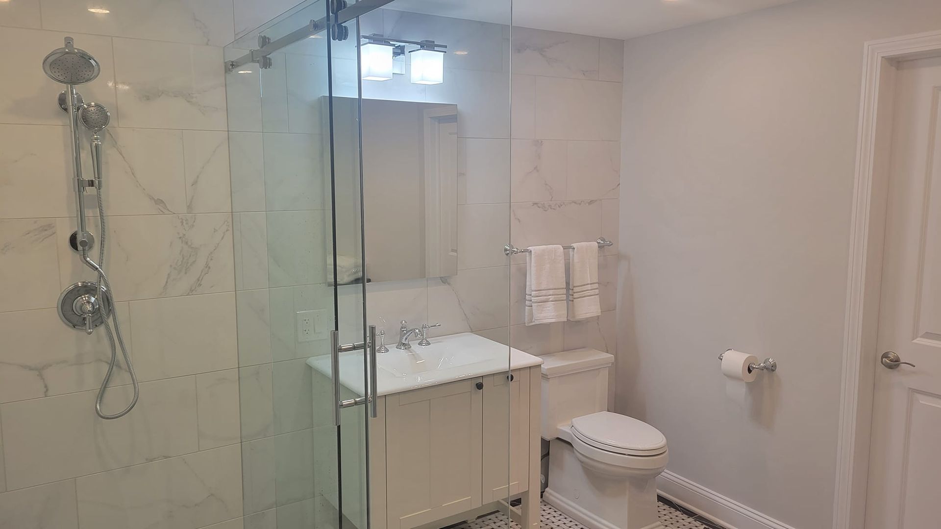 A bathroom with a tub, shower, and window. A bathroom with a tub, shower, and window.