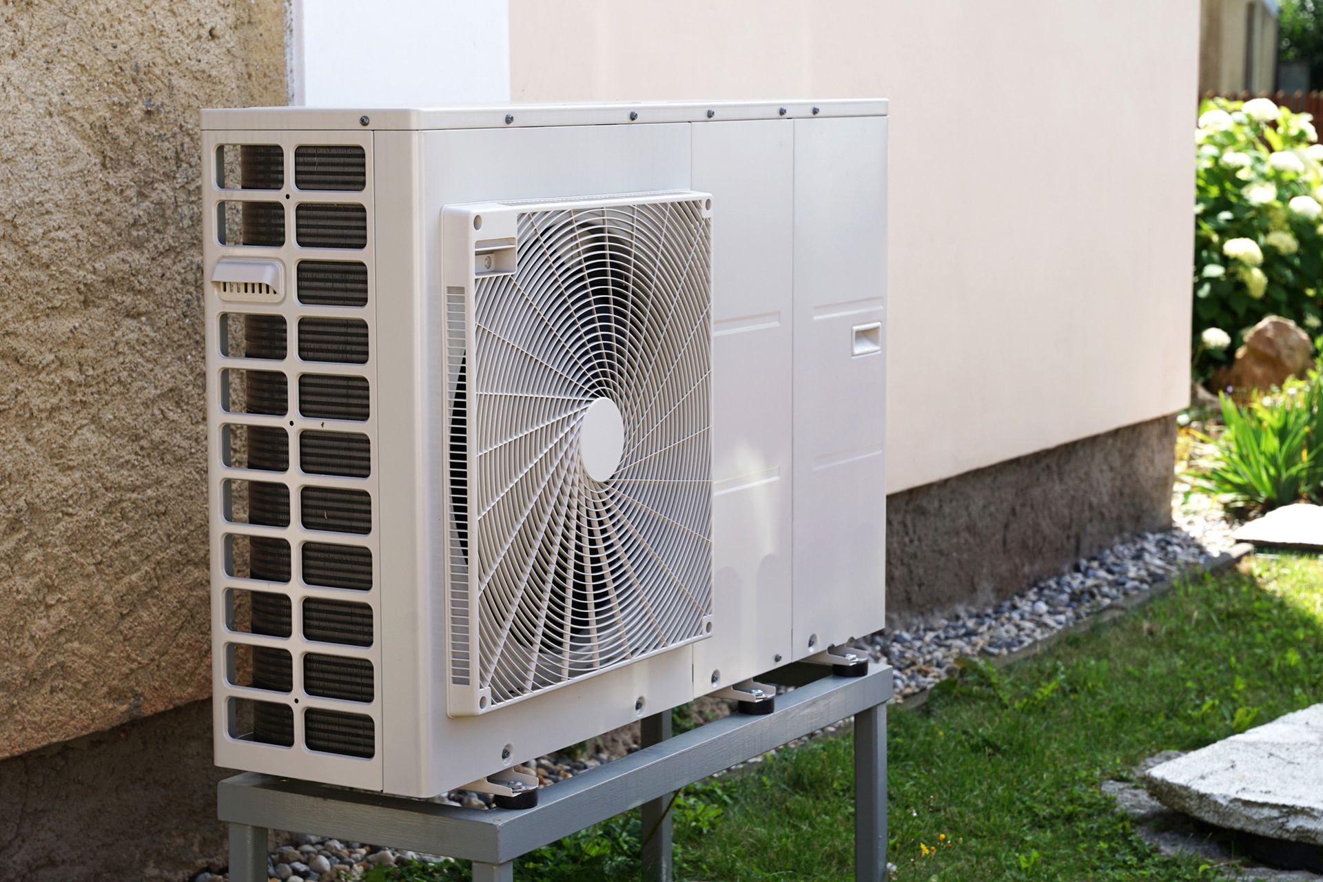 Heat pump outdoor unit in modern house. Heat pump outdoor unit in modern house.