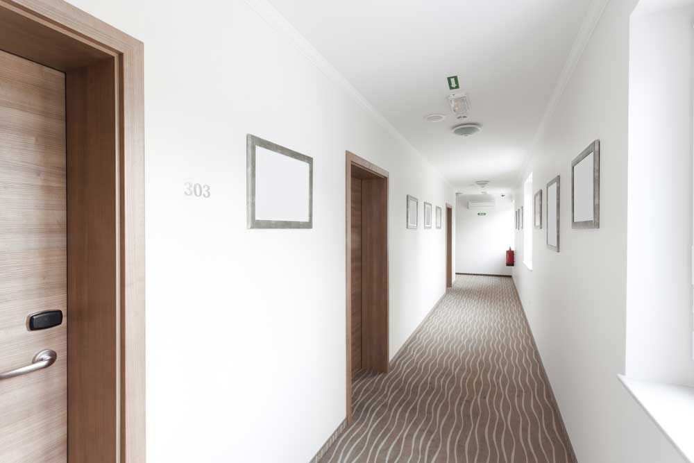Hotel hallway with many rooms that could contain bed bugs