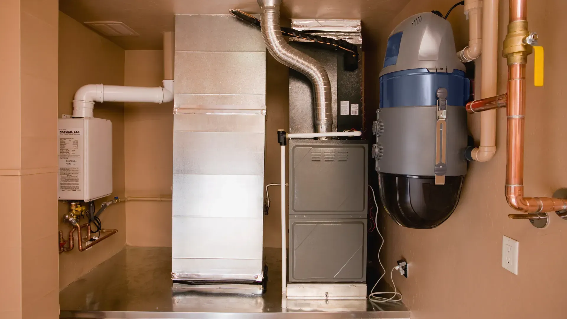 A room with a heater and a vacuum cleaner in it.