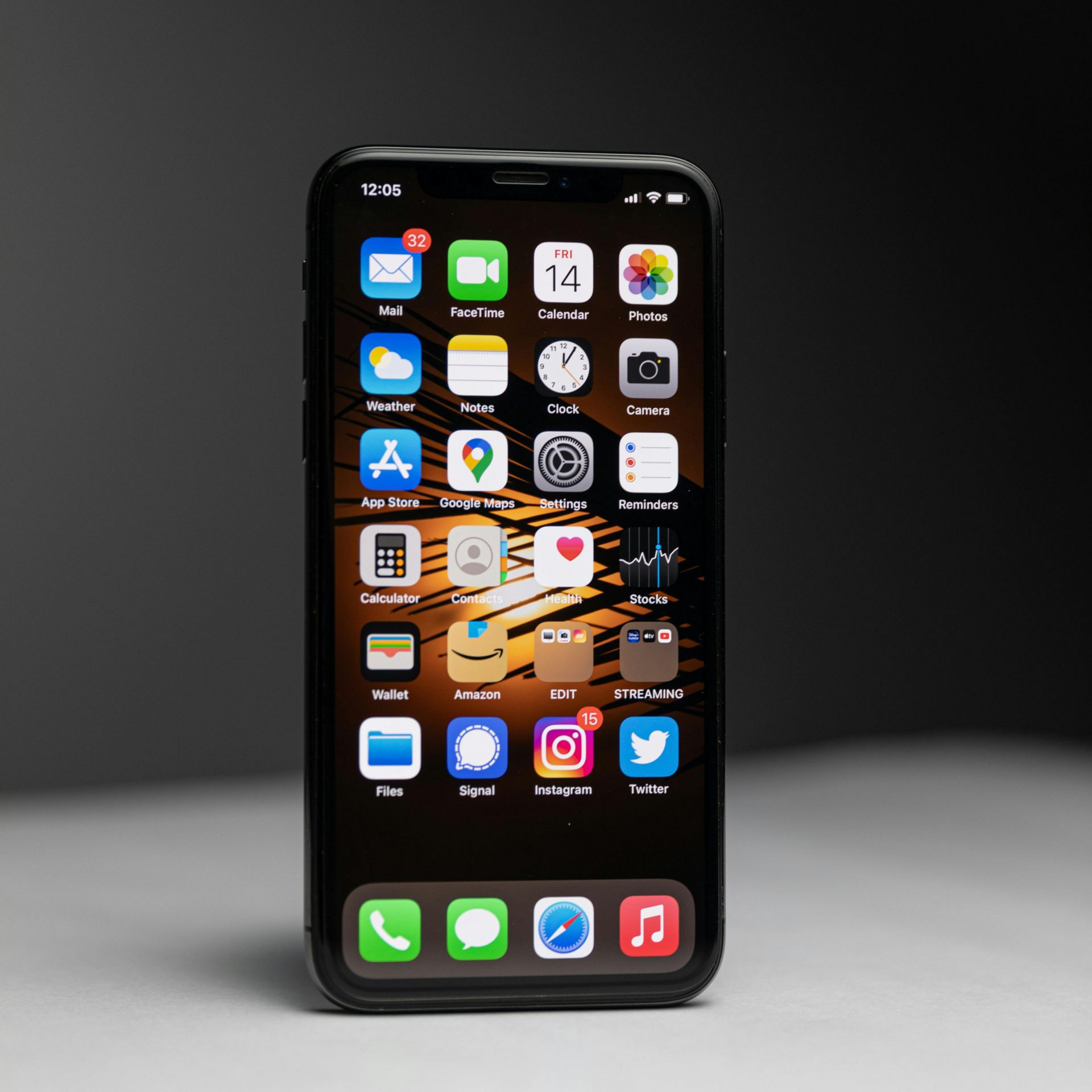 Black iPhone home screen with app icons on a dark background