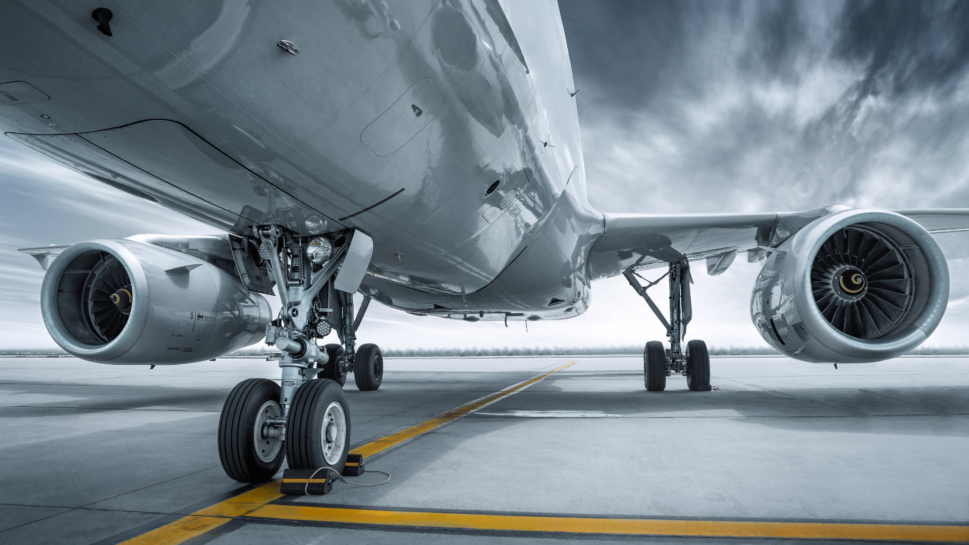 a large passenger jet is parked on the runway at an airport .