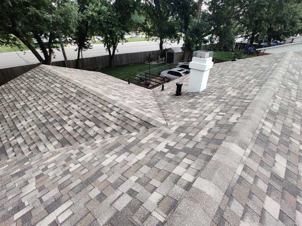 Dimensional IKO Dynasty architectural shingles installed across roof valleys and ridges on a St. Charles County home.