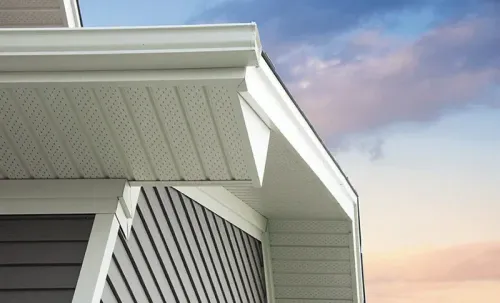 Custom white soffit and fascia trim paired with dark gray horizontal lap siding in St. Charles County.