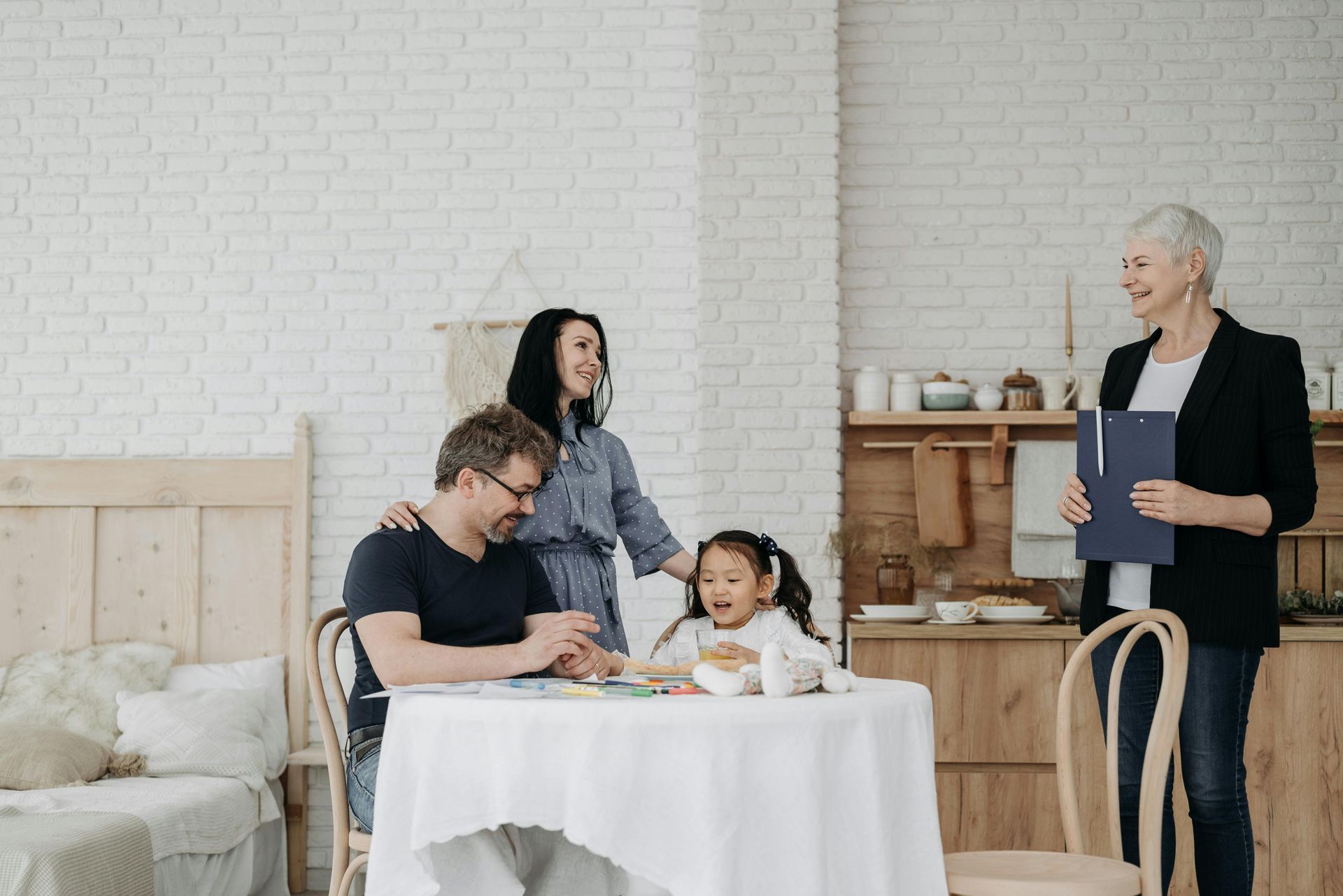 People in a meeting with a child