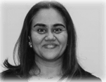 A black and white photo of a smiling woman with long hair.