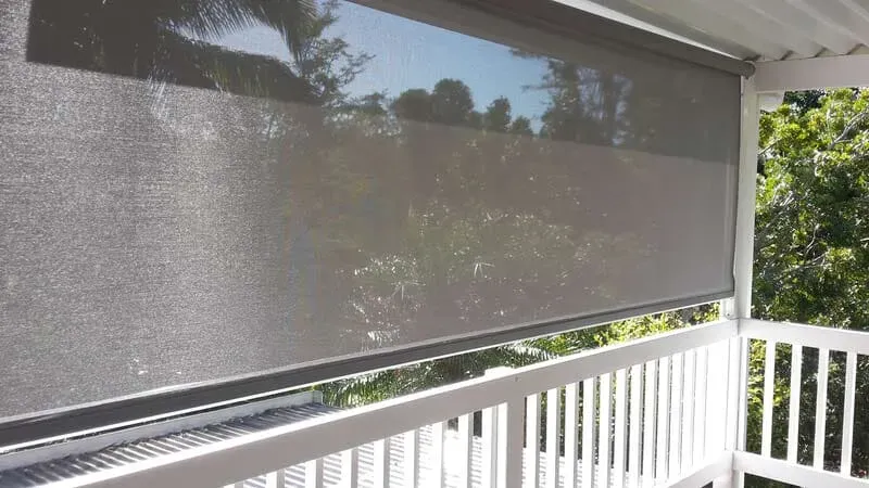 A Screened in Porch With a Gray Shade and a White Railing — Aussie Carpets & Vinyl In Beerwah, QLD