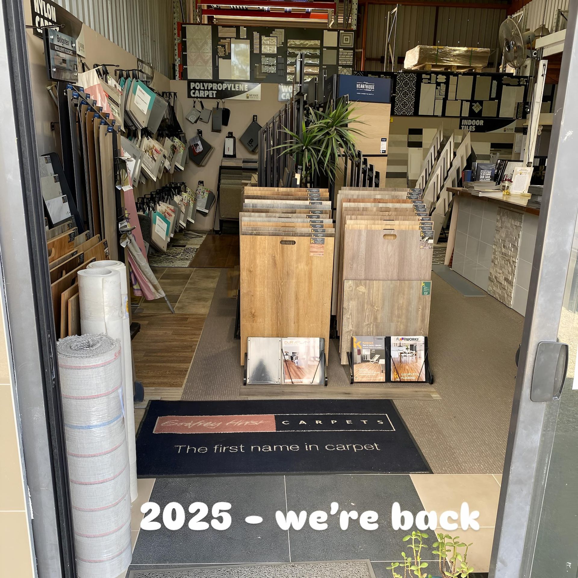 A Store With a Sign That Says 2025 We're Back — Aussie Carpets & Vinyl In Beerwah, QLD